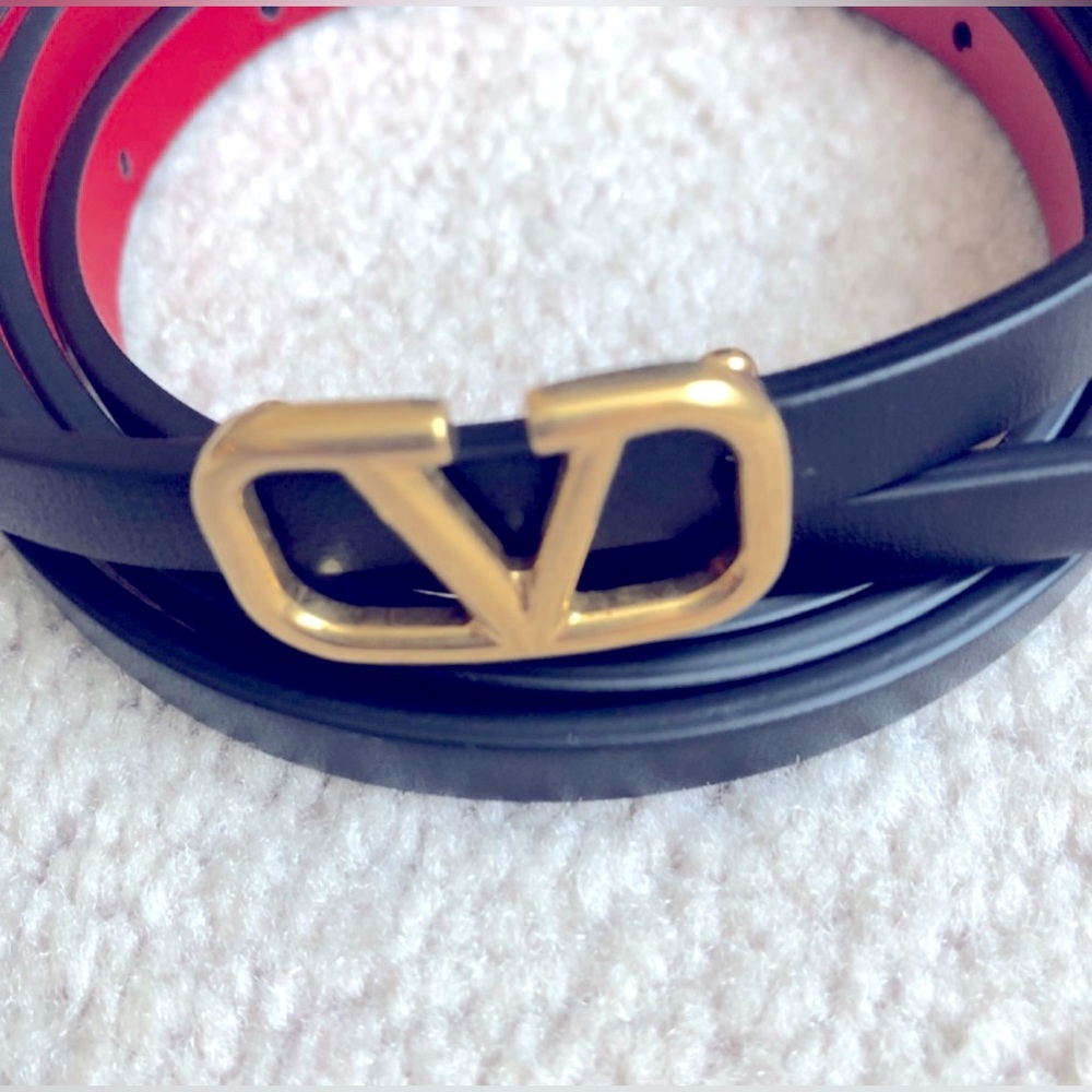 Valentino thin belt reversible red and black with gold buckle.